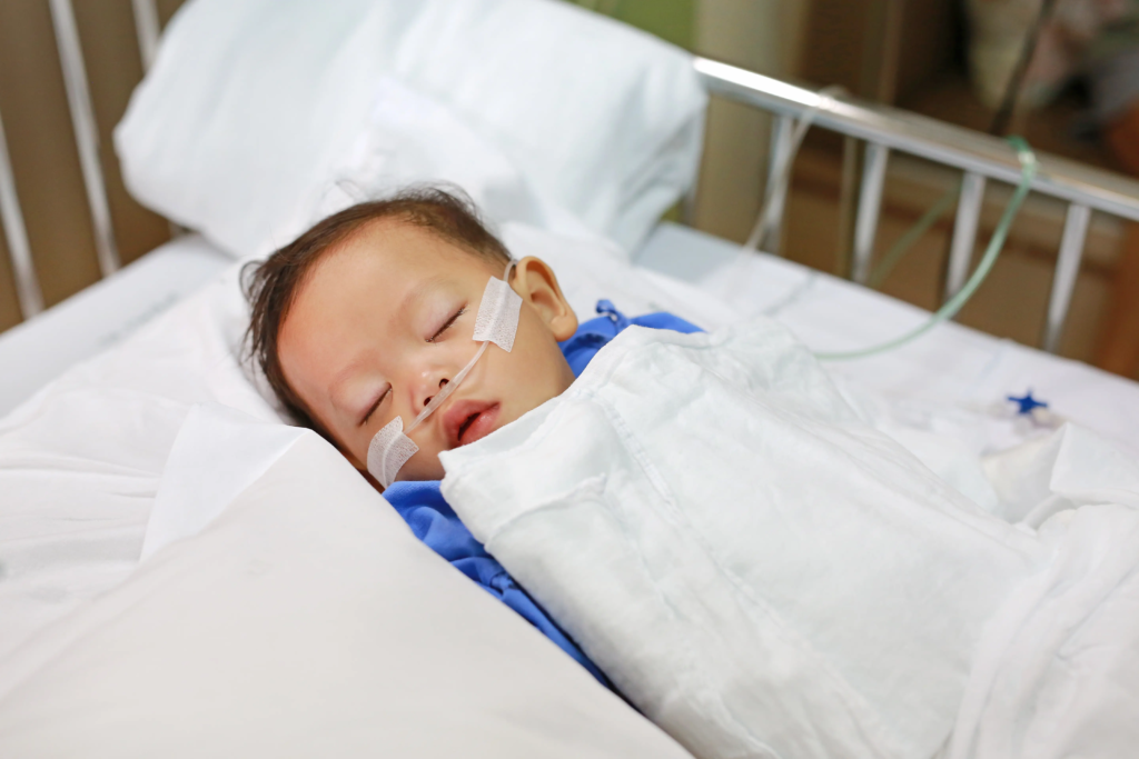 Young child receiving oxygen in hospital